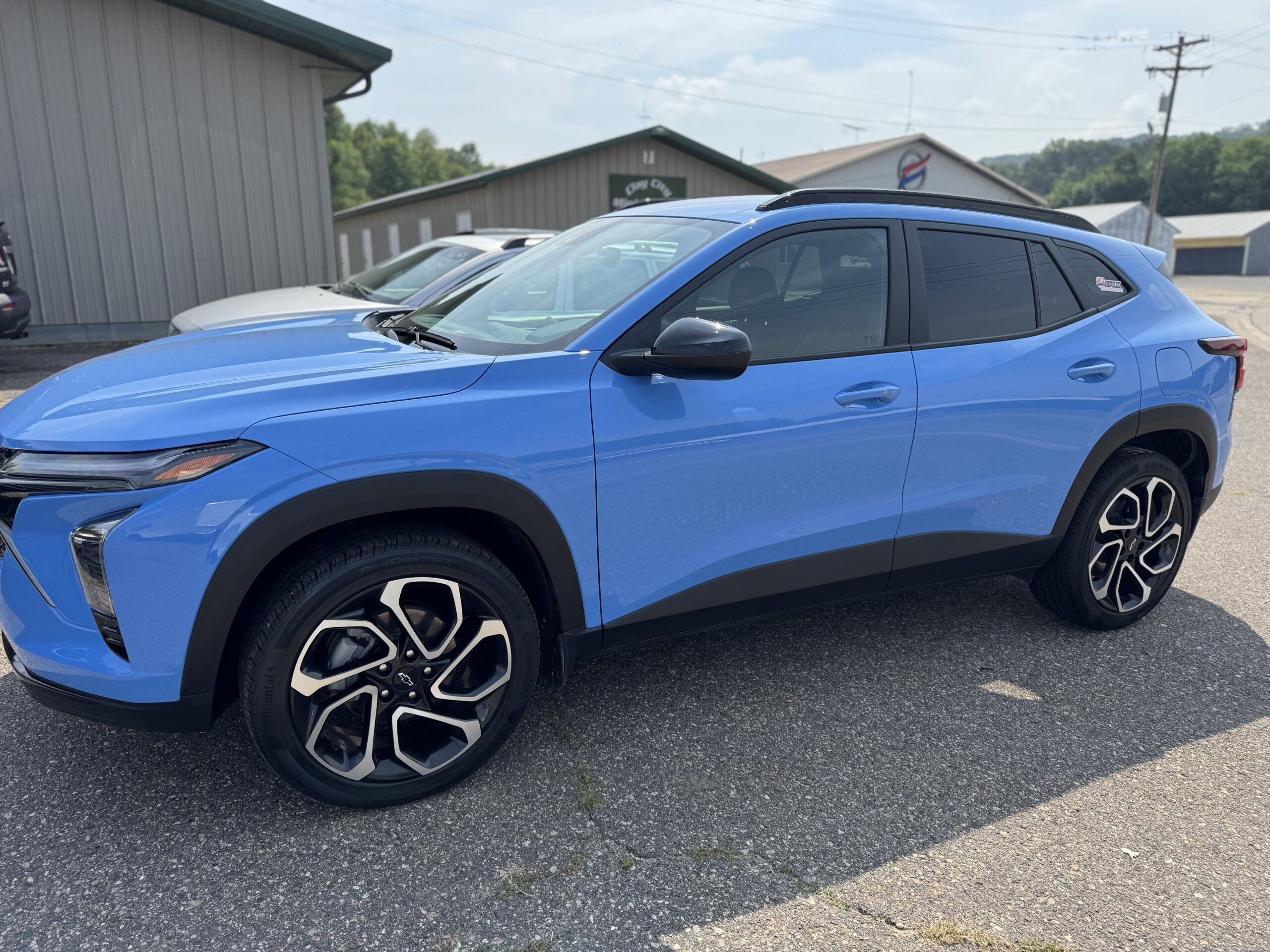 Falk Auto Body in Red Wing MN rents cars. shown blue Chevy Trax