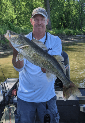 Photo of Marty Hahn holding a huge fish he caught on the Mississippi river in Red Wing, MN