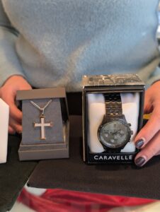 Photo of men's watch and cross necklace for sale at Howes Diamond Jewelers in red wing, mn